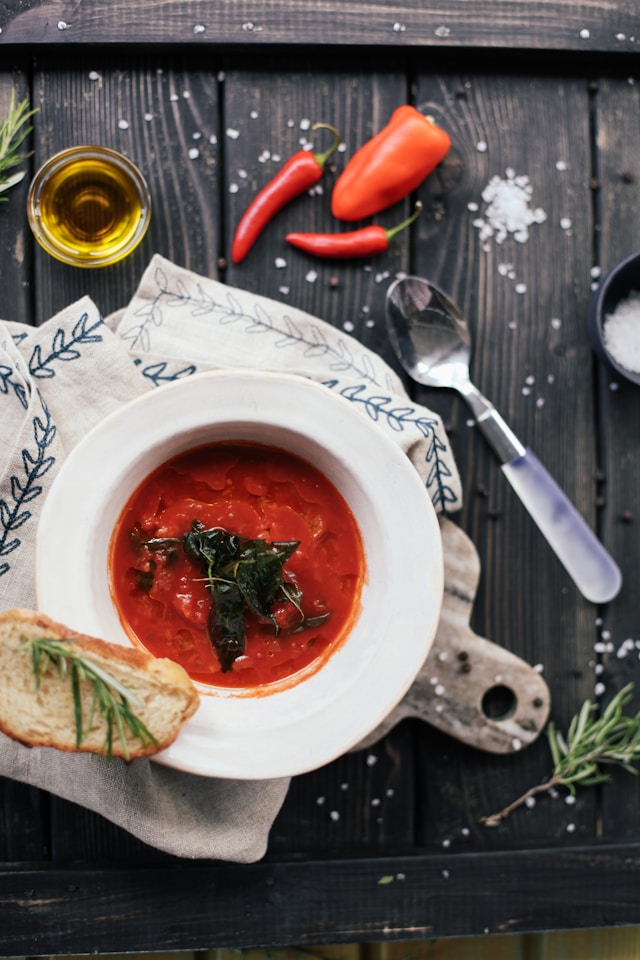 A photo of a red, meaty soup